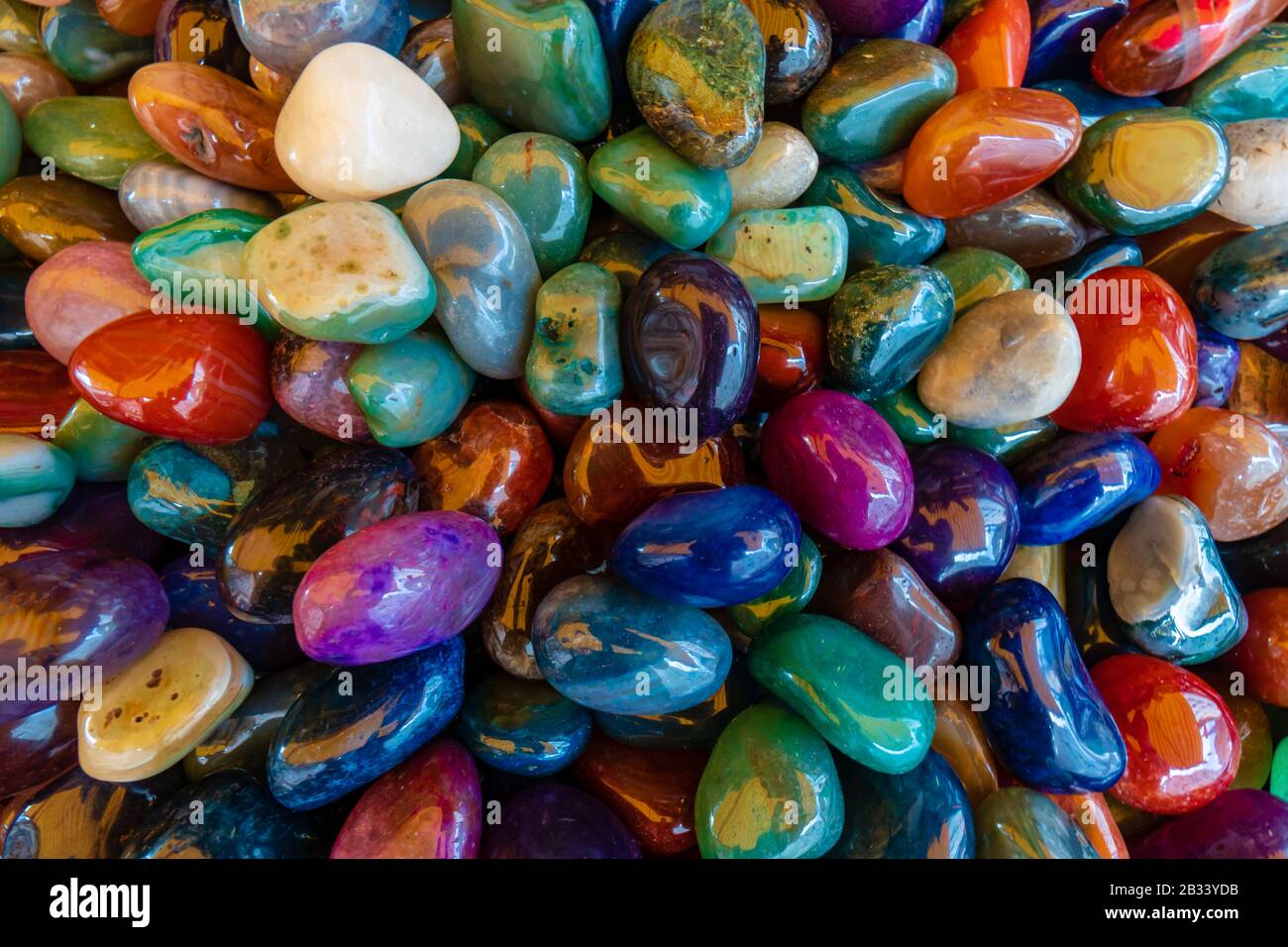 Multicolor Glass Rocks Different coloured glass stones background Stock Photo - Alamy