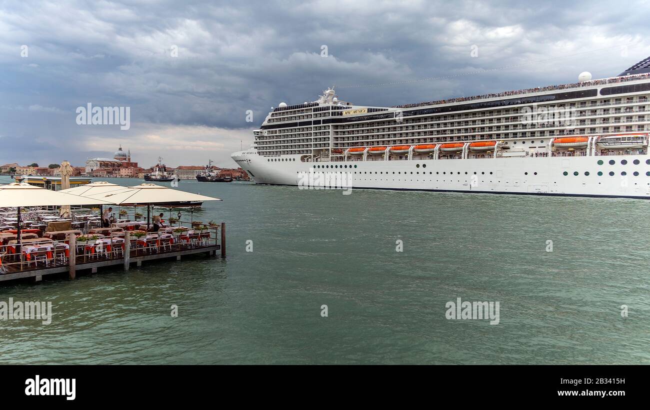 Massive Cruise Ship Msc Musica Dominating The Skyline Of Venice Italy As It Leaves In The Evening Stock Photo Alamy
