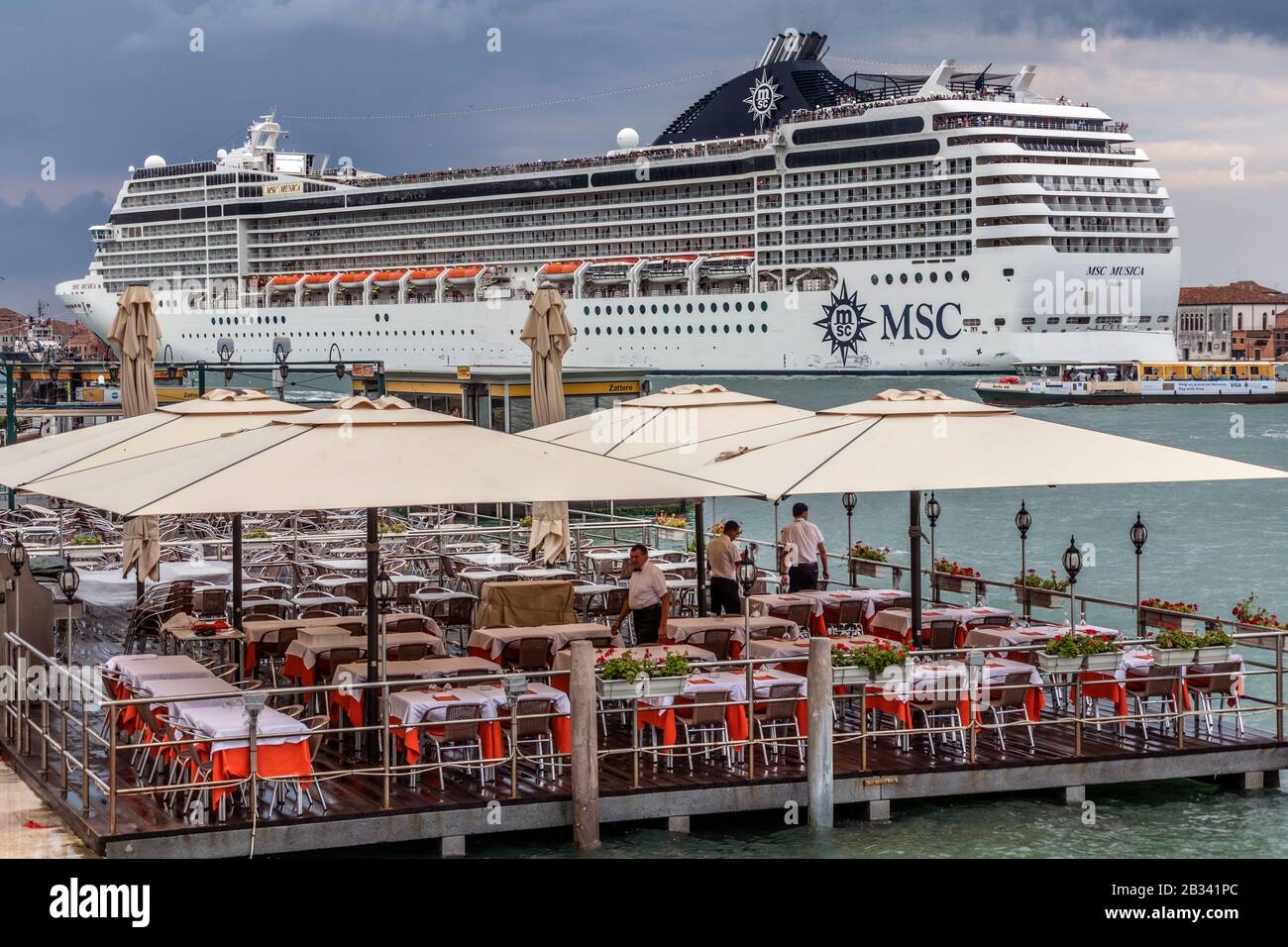 Massive Cruise Ship Msc Musica Dominating The Skyline Of Venice Italy As It Leaves In The Evening Stock Photo Alamy