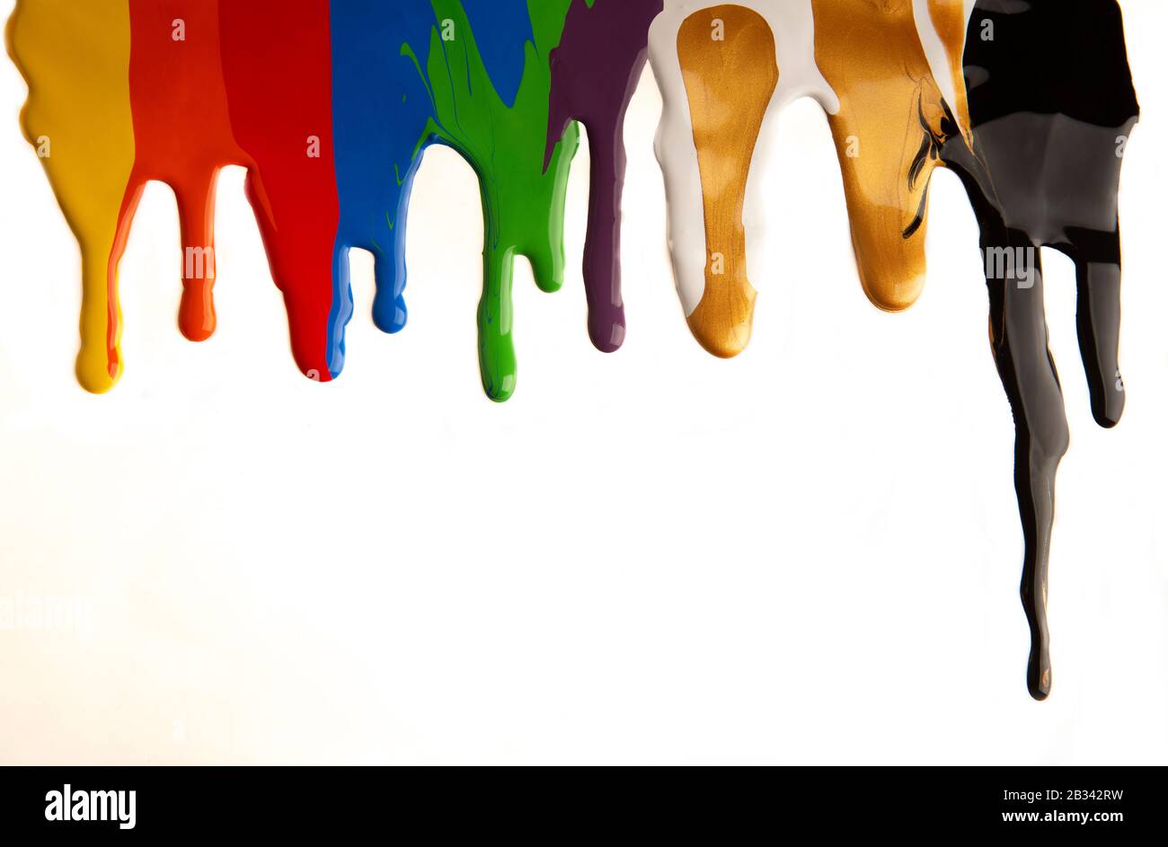 Colorful paint dripping isolated on a white background Stock Photo