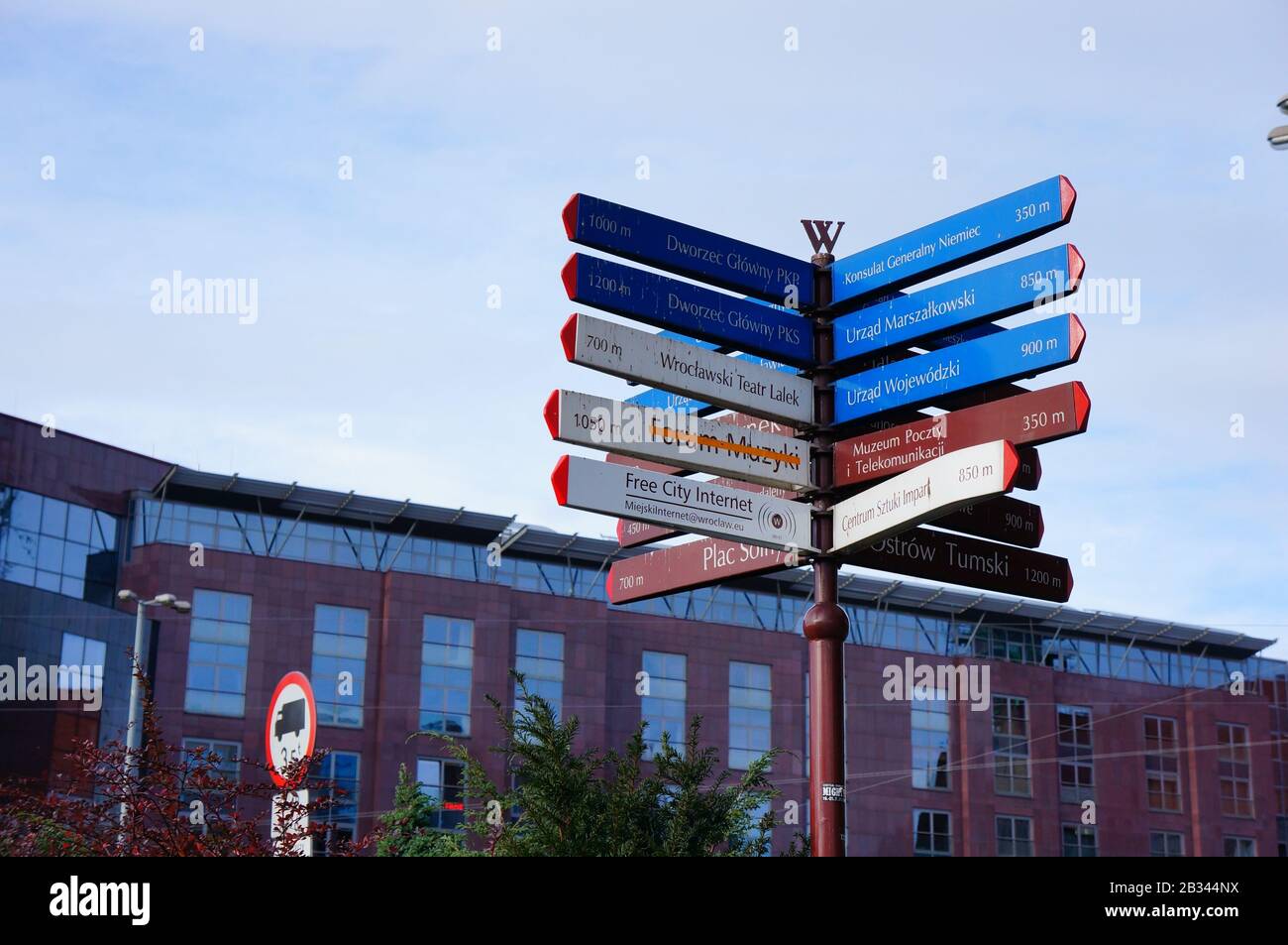 WROCLAW, POLAND - Nov 10, 2013: Many direction signs showing the way to ...