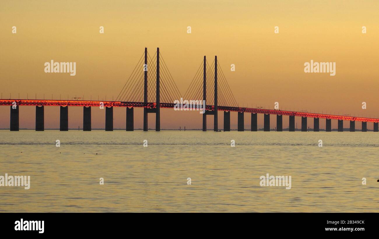 Oresund-Bridge reflecting orange  light of sunset * die Öresund-Brücke bei Malmö reflektiert das Licht des Sonnenuntergangs Stock Photo