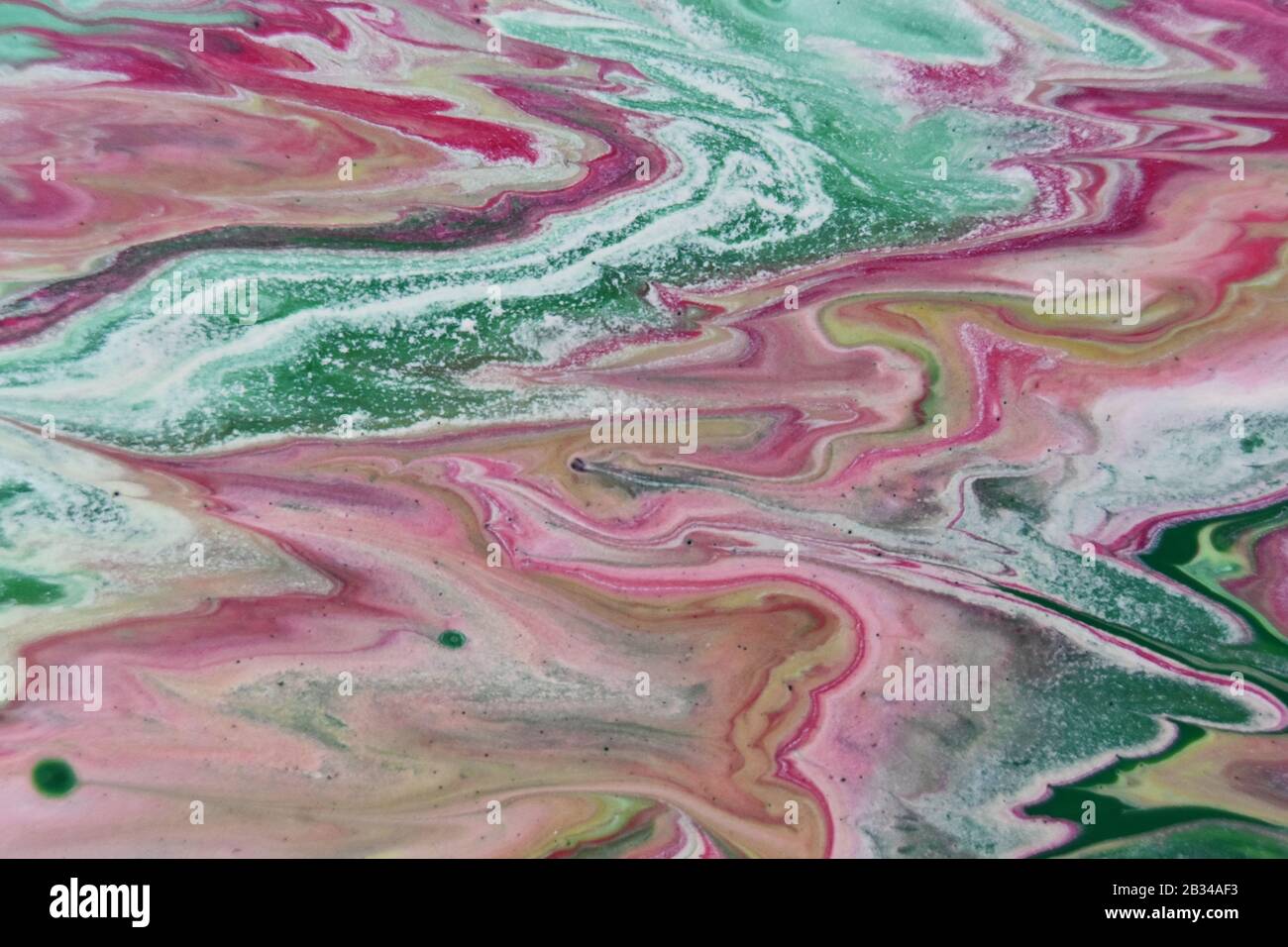 Closeup shot of abstract patterns created with bright paints mixed in the water Stock Photo