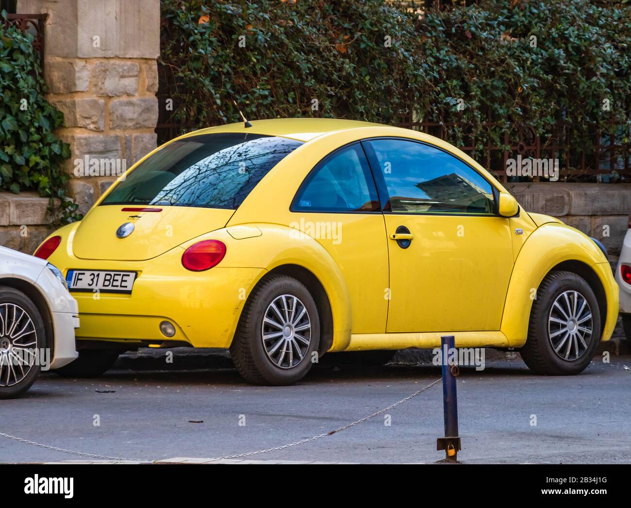 Yellow Volkswagen new Beetle car parked on a street of Bucharest, Romania,  2020 Stock Photo - Alamy