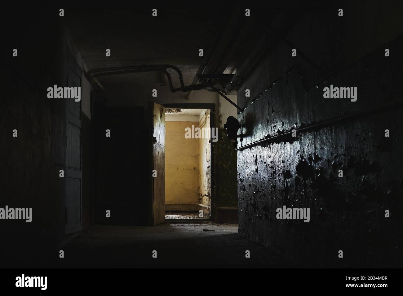 Old hall with weathered walls and an old door Stock Photo - Alamy