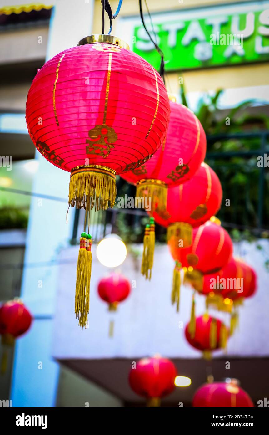 Vertical shot of Chinese lamps hanging in a line Stock Photo - Alamy
