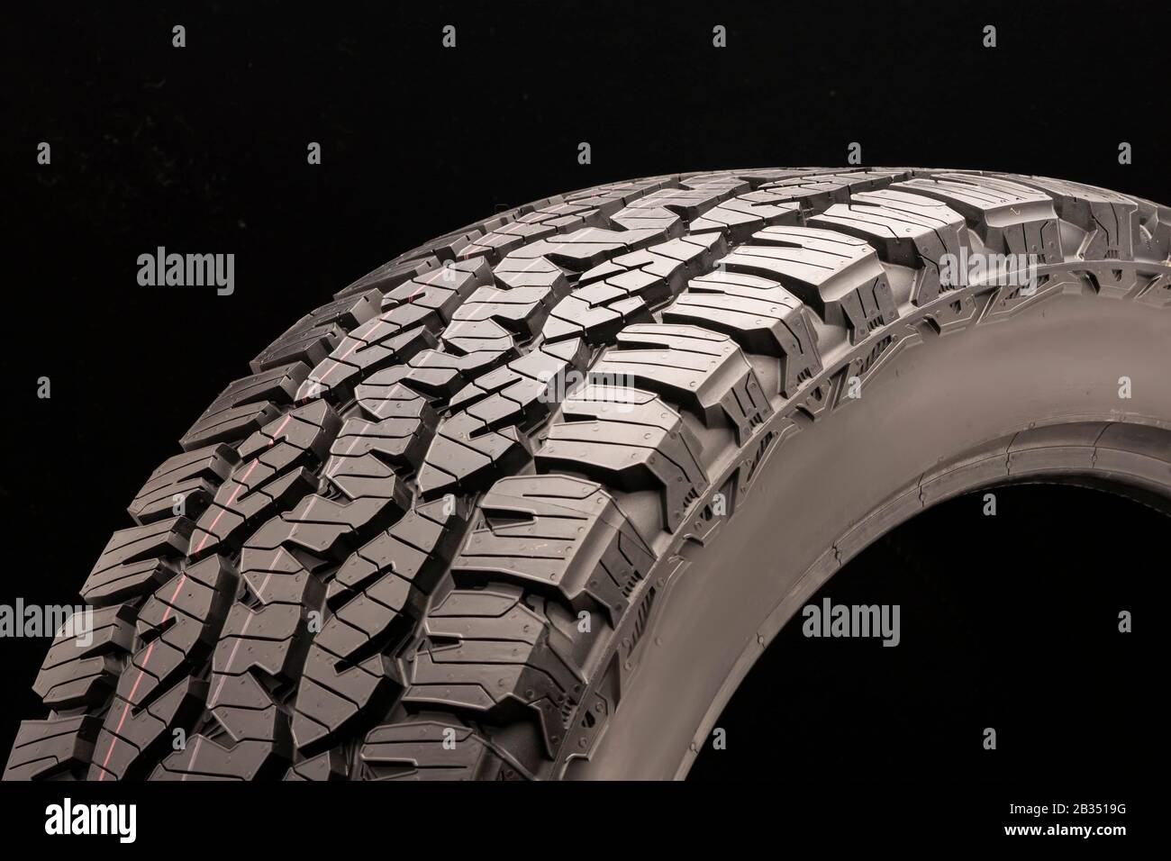 matador izzarda at 2-all-season off-road tires all terrain, sidewall close  -up on a dark background Stock Photo - Alamy