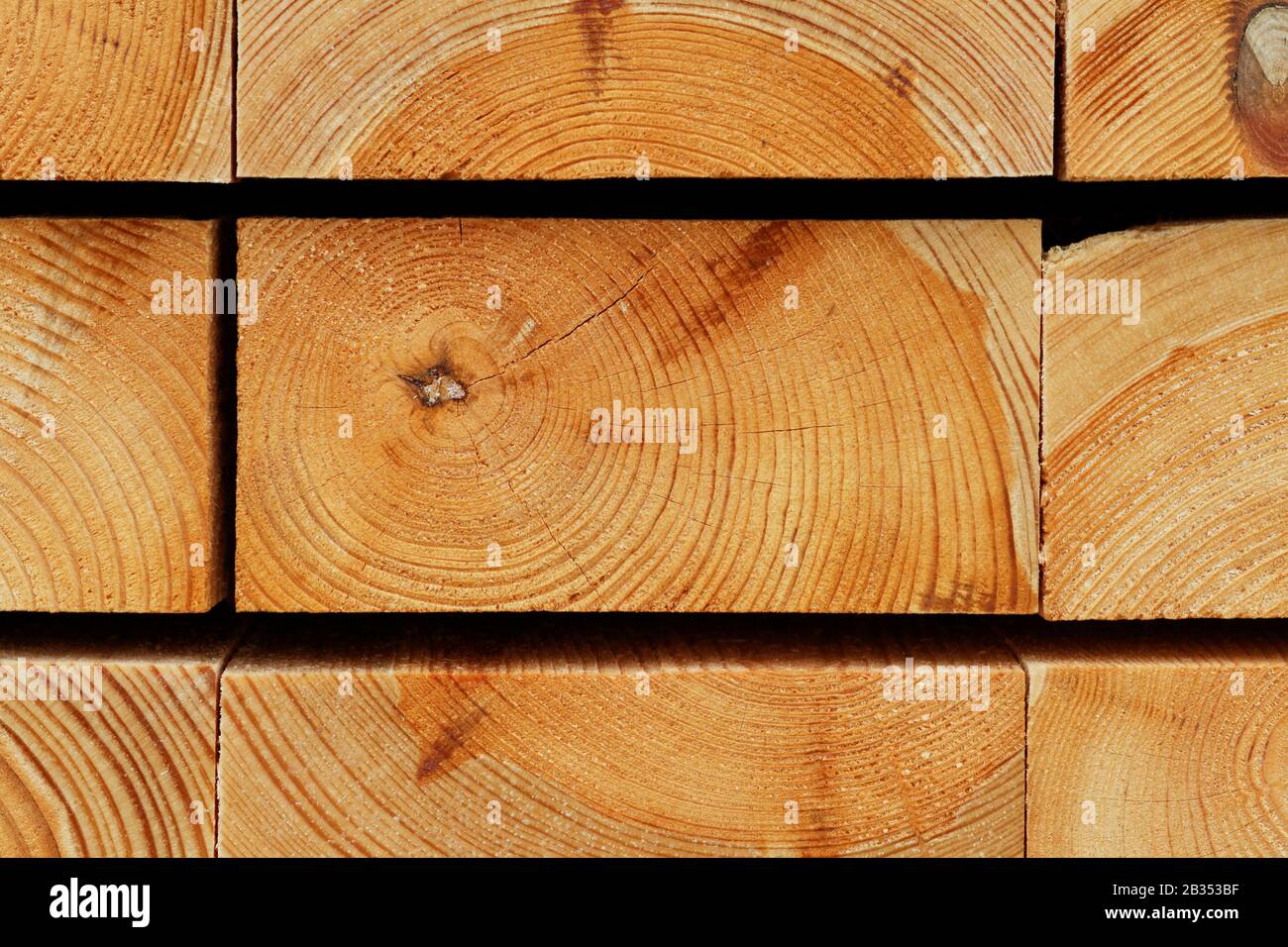 Timber Background: Annual Rings Texture of Piled Pine Construction Boards Stock Photo