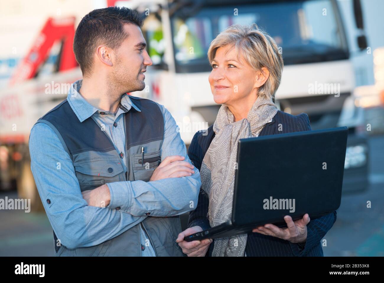 engineers with laptop outside field Stock Photo