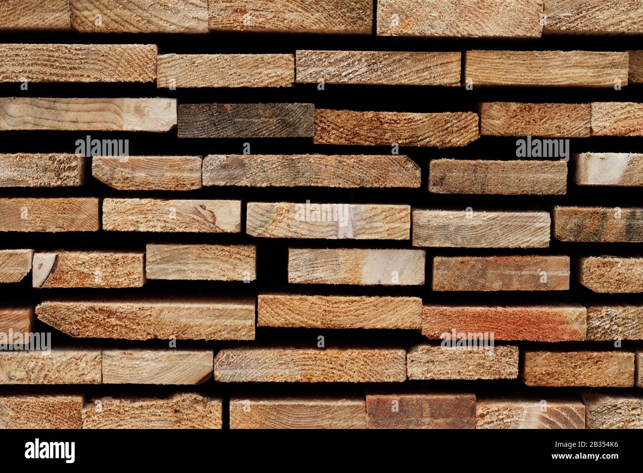 Wood Texture Background: Raw Edges of Stacked Softwood Slats Stock Photo