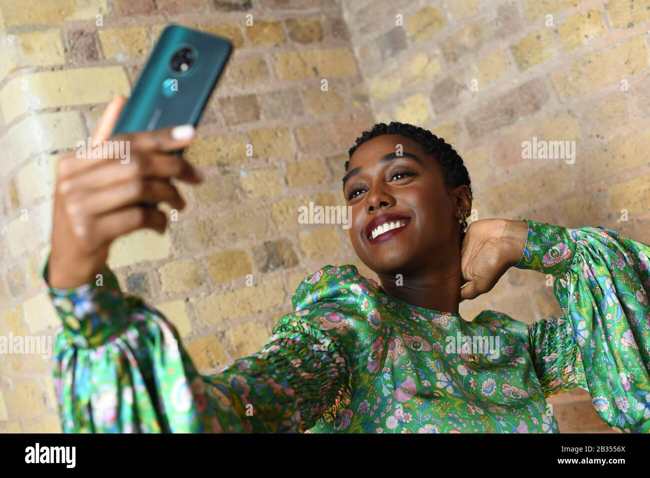 EMBARGOED TO 0001 THURSDAY MARCH 5 EDITORIAL USE ONLY Actress Lashana Lynch who plays Agent Nomi in the upcoming James Bond No Time To Die film, helps HMD Global, the home of Nokia phones unveil their largest ever global marketing campaign at the London Film Museum. Photo. Issue date: Thursday March 5, 2020. To celebrate the partnership, Lashana features in a new campaign for Nokia phones - The Only Gadget You Will Ever Need - which has been directed by BAFTA Award-winning director Amma Asante. Photo credit should read: Doug Peters/PA Wire Stock Photo