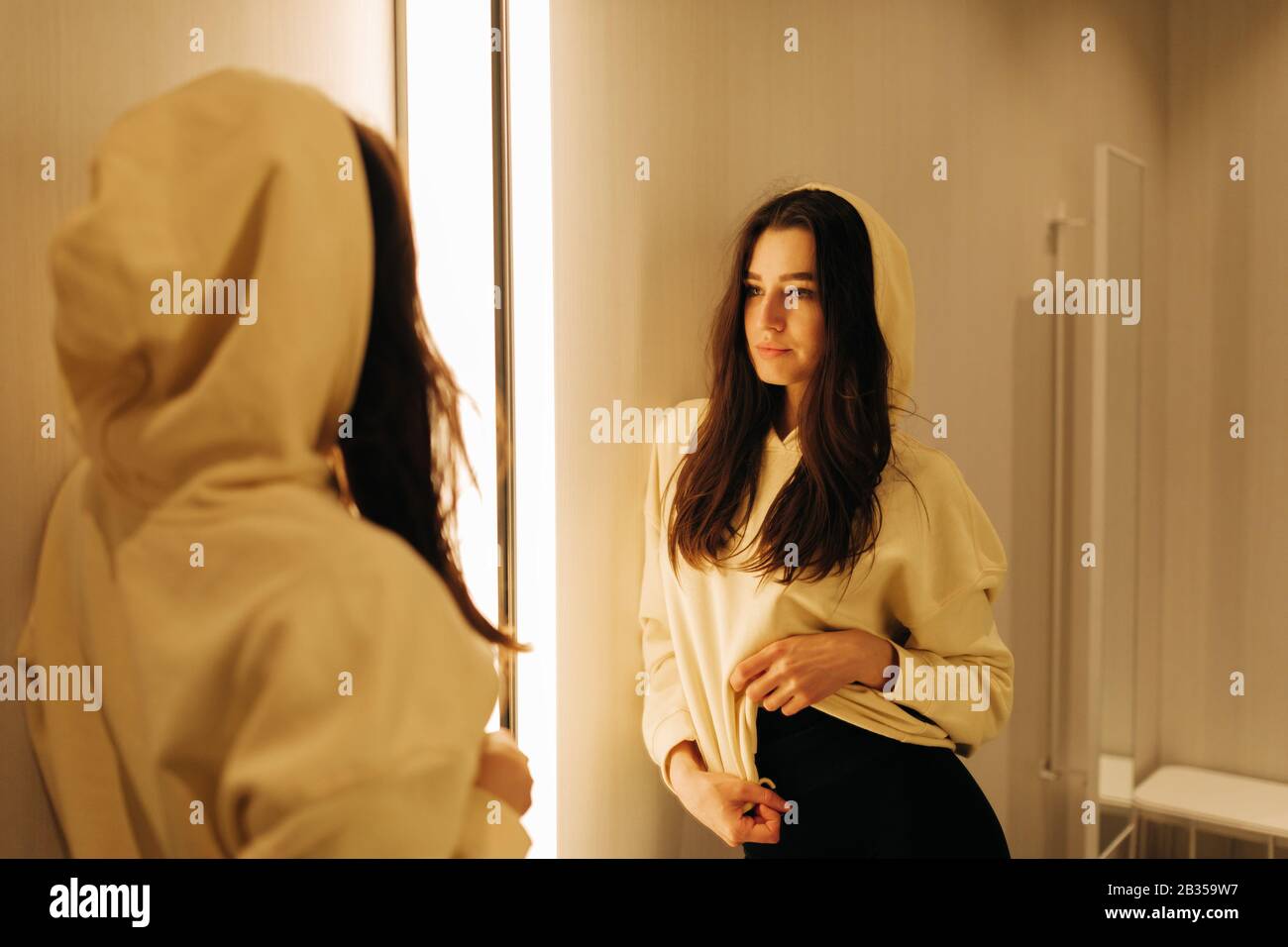 young woman in the fitting room Stock Photo