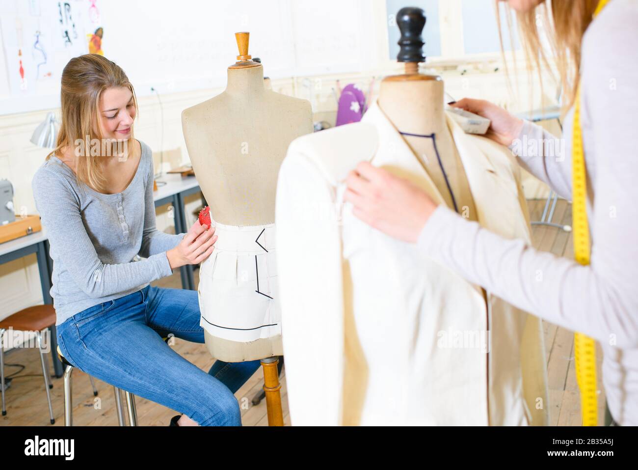women using mannequins to create garments Stock Photo Alamy