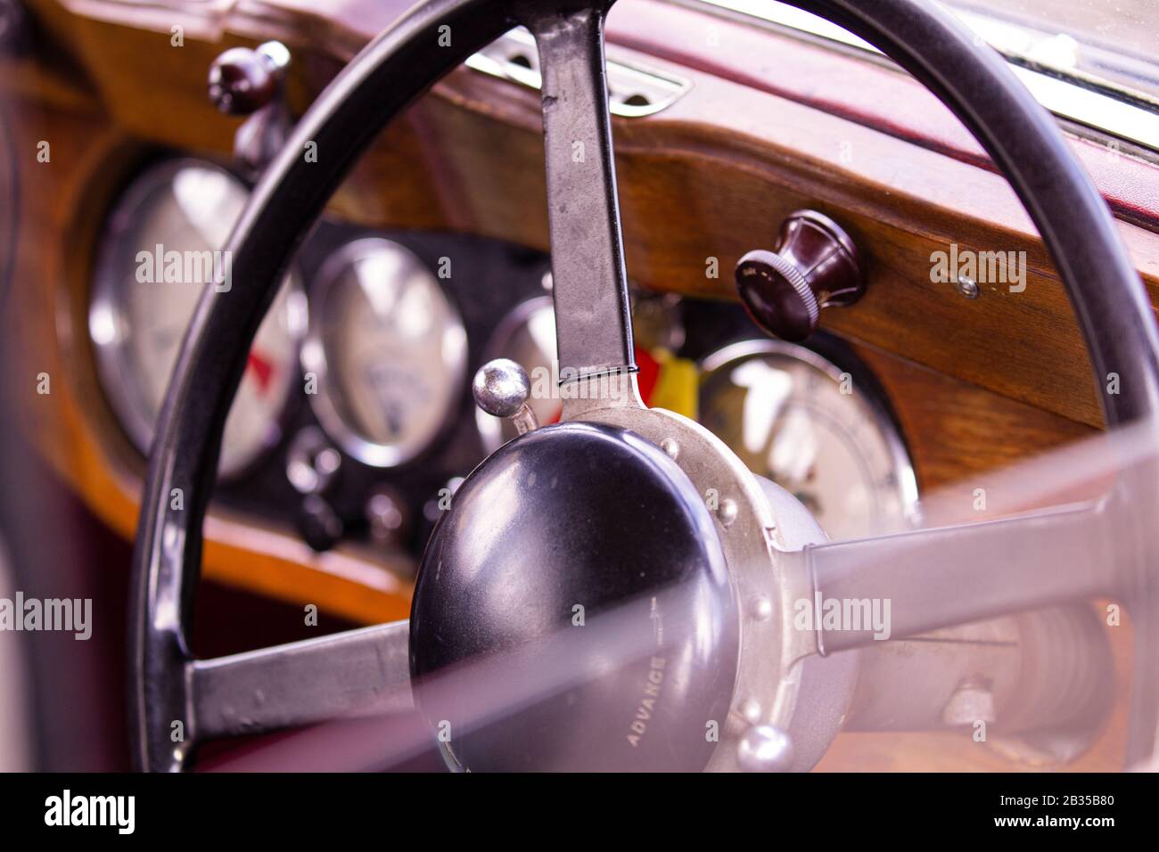 Interior of an old British Classic car focusing on the interior dials
