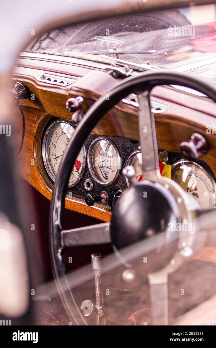 Interior of an old British Classic car focusing on the interior dials