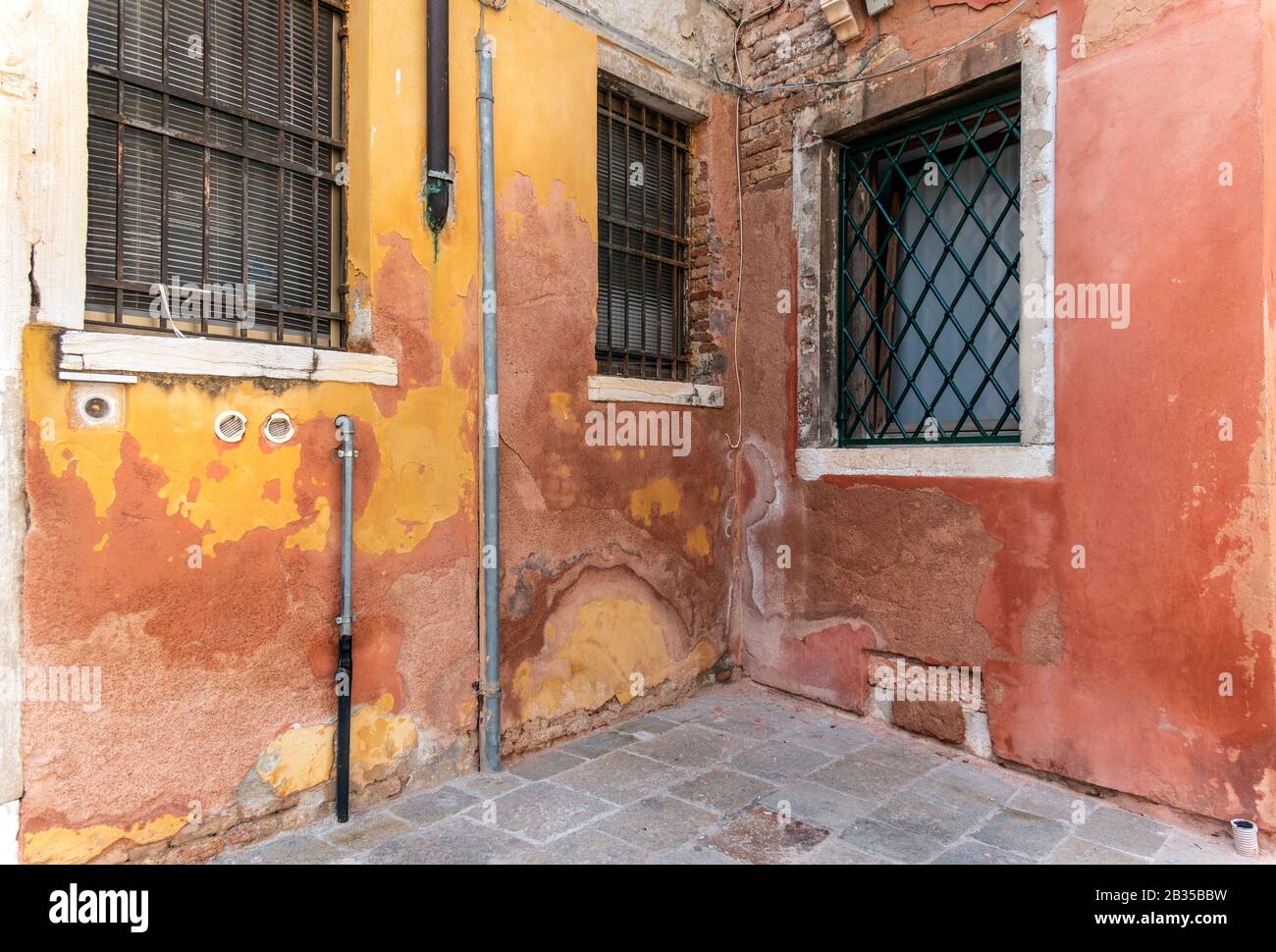Corner. Colourful peeling paint, Venice, Italy. Stock Photo