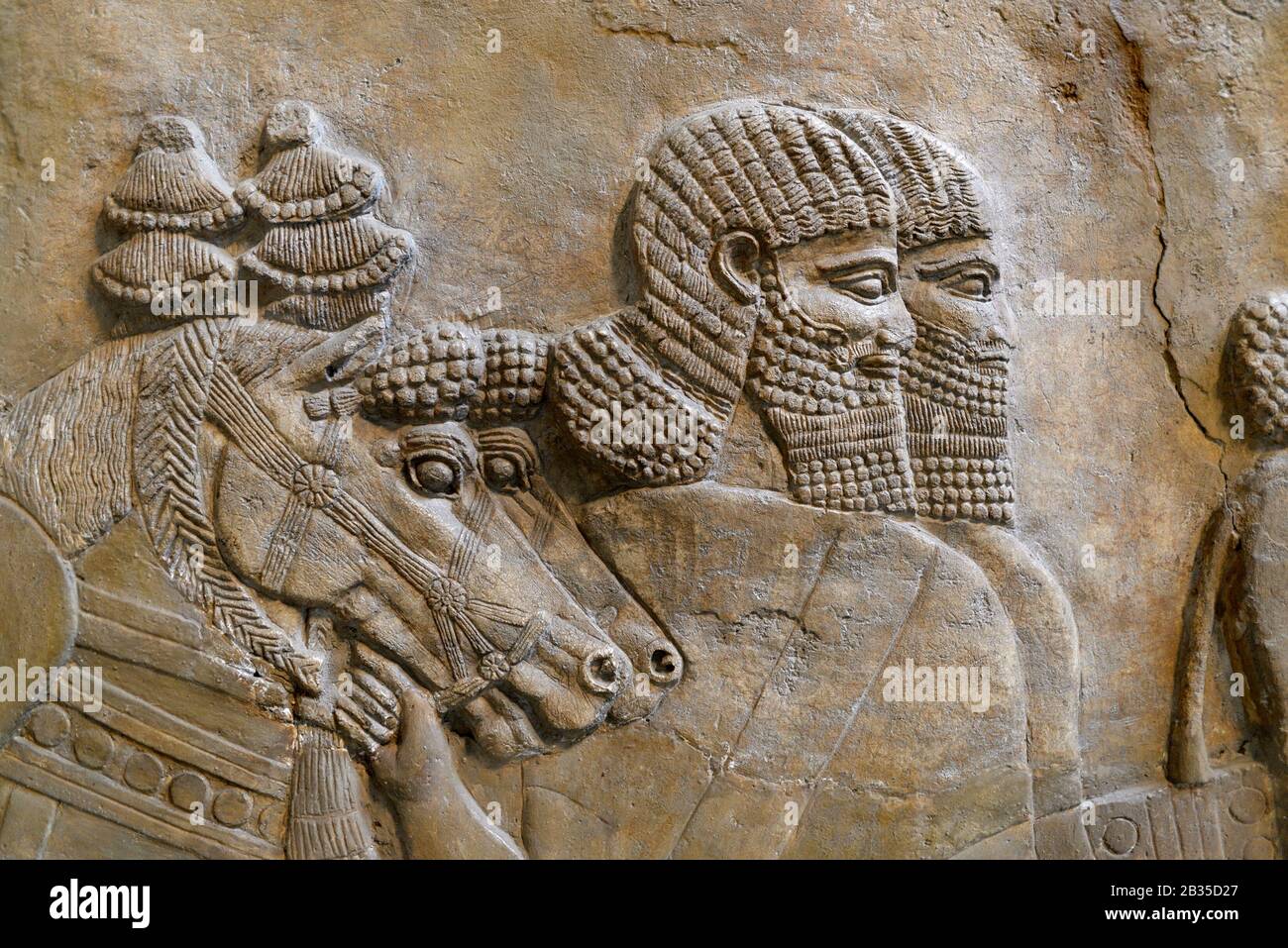 Detail of Assyrian stone carving (725BC) From Nimrod, Central Palace. British Museum, Bloomsbury, London, England, UK. Stock Photo