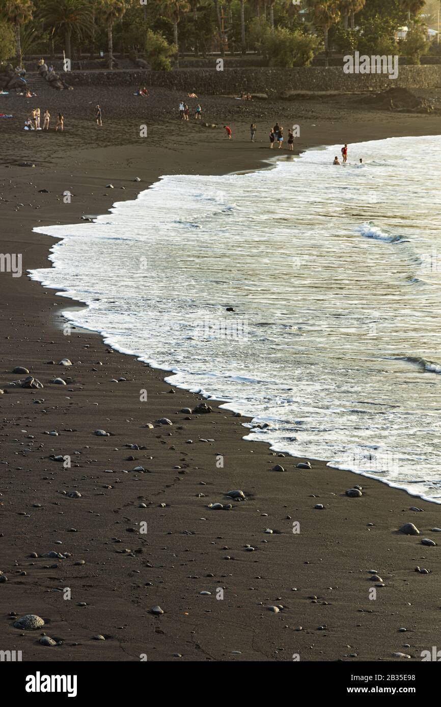 People on the beach at Playa Jardin, Puerto de la Cruz, Tenerife, Canary Islands, Spain, Stock Photo