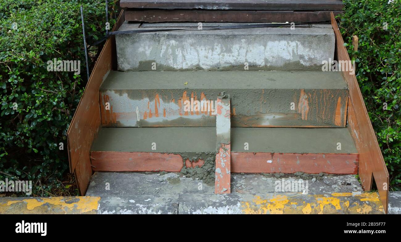 Construction of steps in progress, mixed cement in wooden mold waiting for setting time Stock Photo