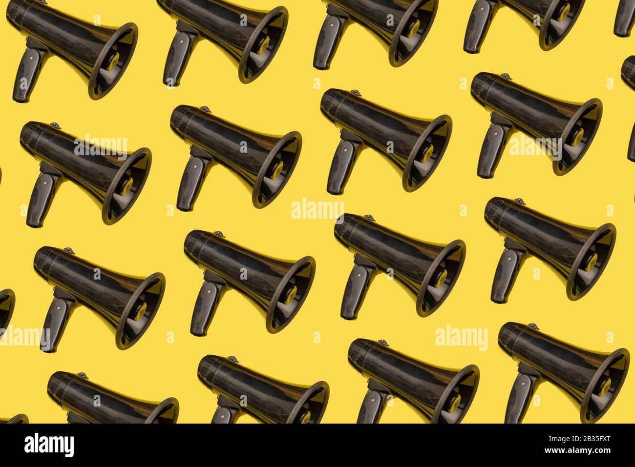 Collage of black load speaker on yellow backboard, wake up Concept