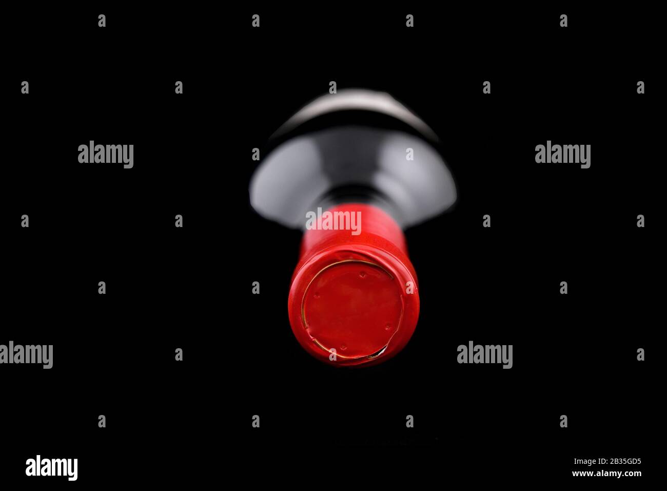 Bottle of wine lying down on a dark background Stock Photo Alamy
