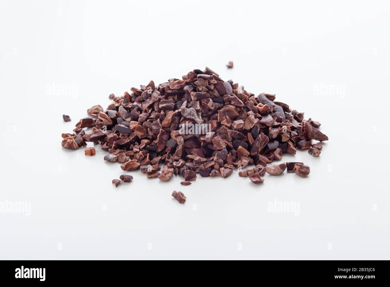 Cacao nibs on white background Stock Photo Alamy