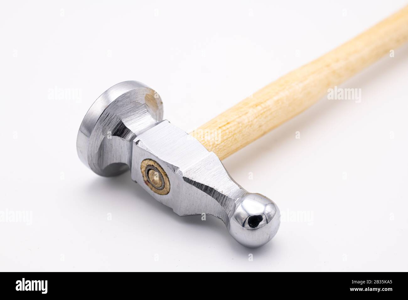 Closeup of a chasing hammer lying on a white background Stock Photo Alamy
