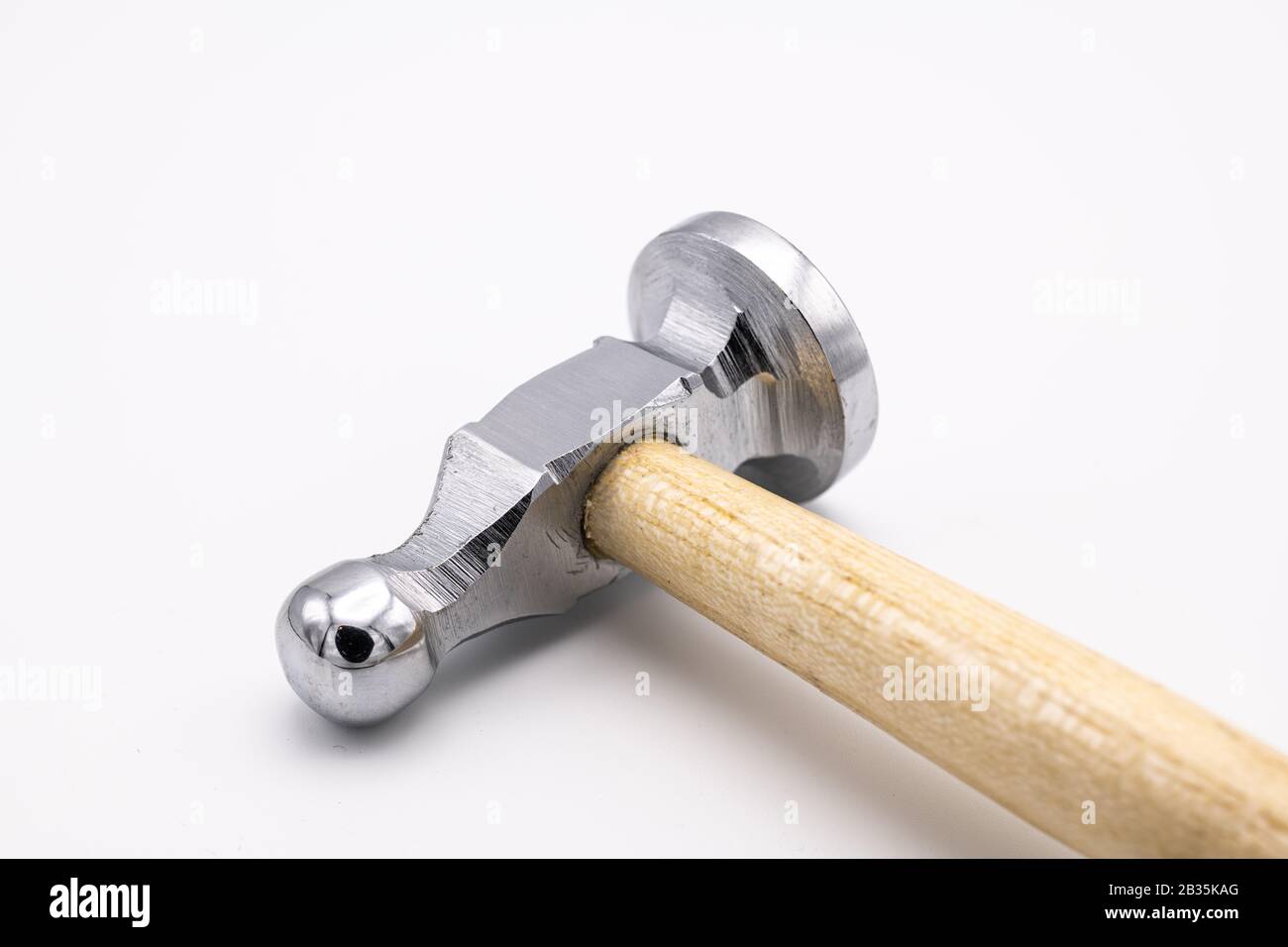 Closeup of a chasing hammer lying on a white background Stock Photo Alamy