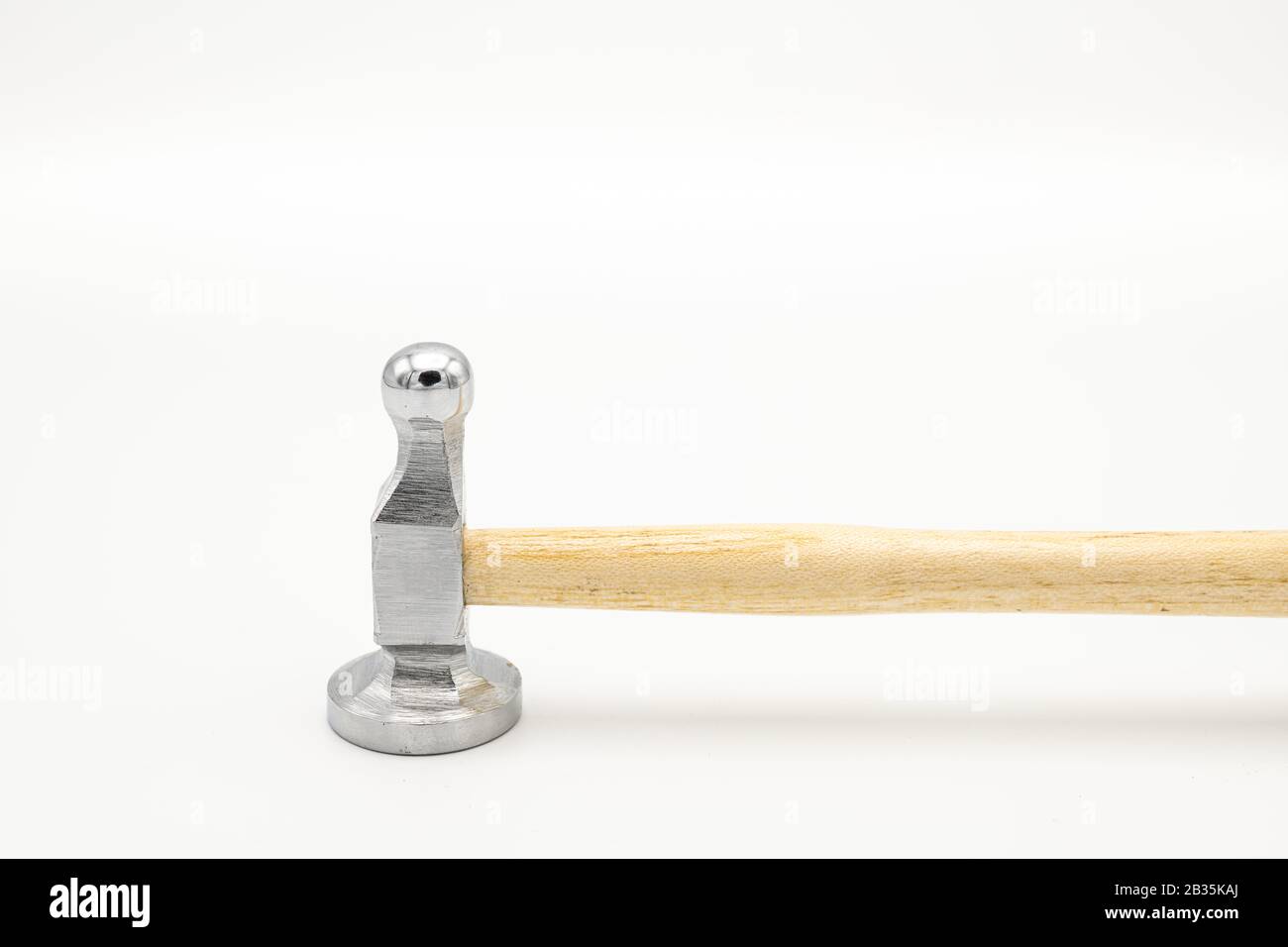 Closeup of a chasing hammer lying on a white background Stock Photo Alamy