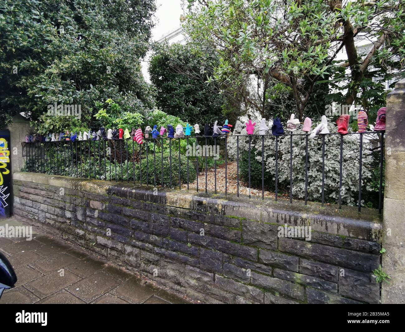 Metal Fence with woollen gloves Stock Photo