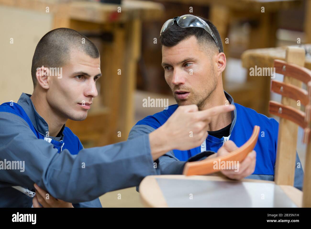 two artisans having a discussion Stock Photo