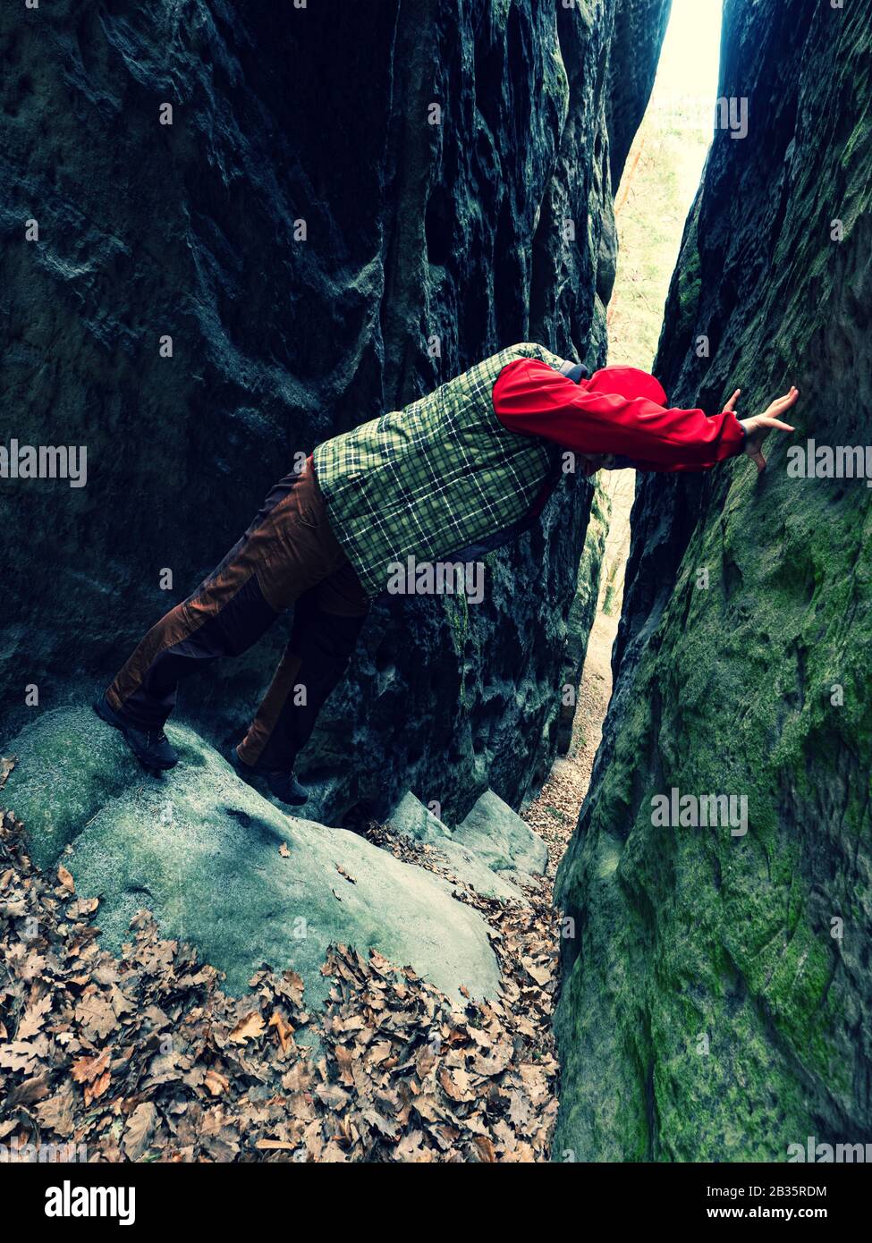 Climbing for fun. Young woman makes crazy climbing steps between close