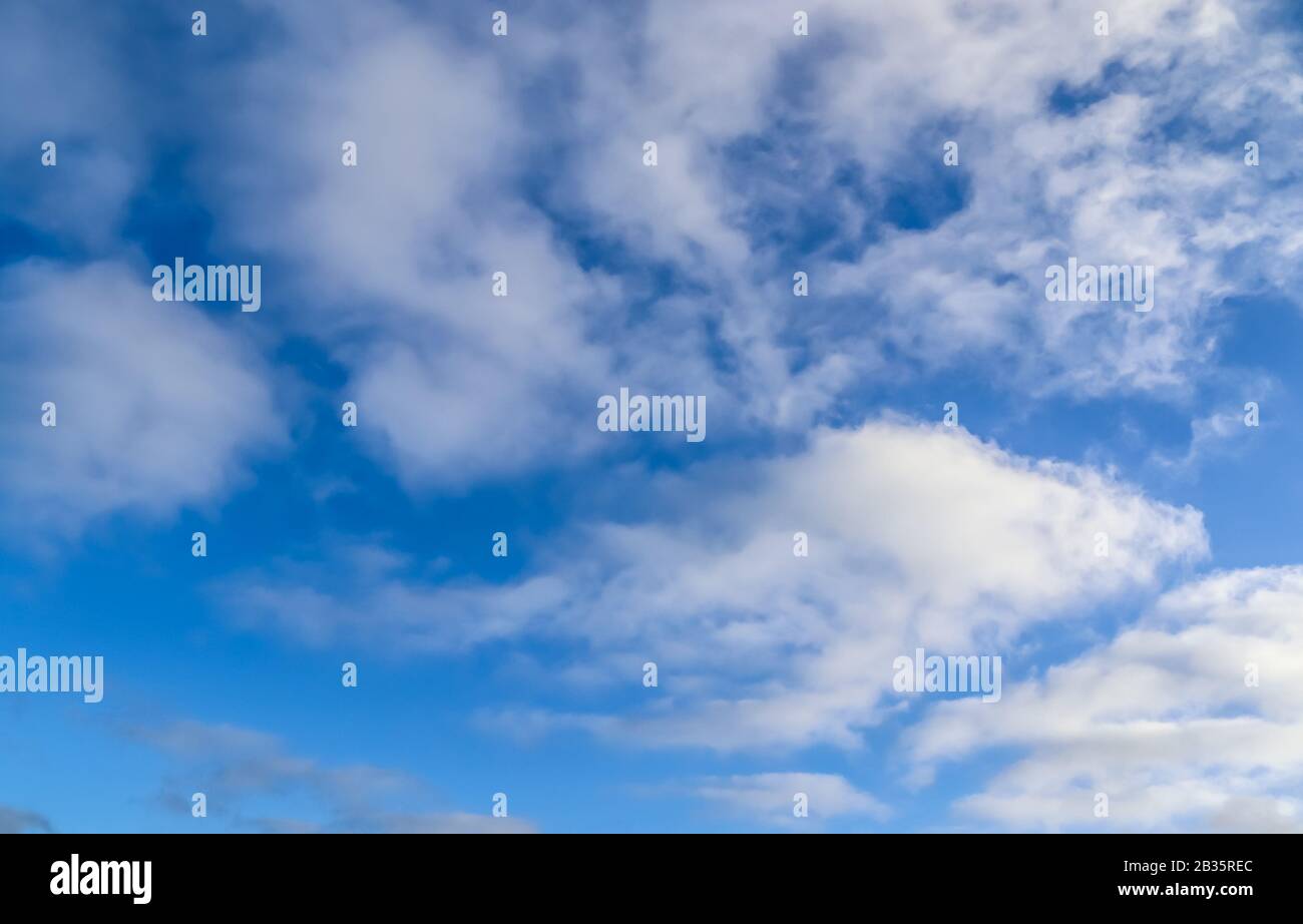 Beautiful white and fluffy cumulus clouds in a deep blue sky Stock ...