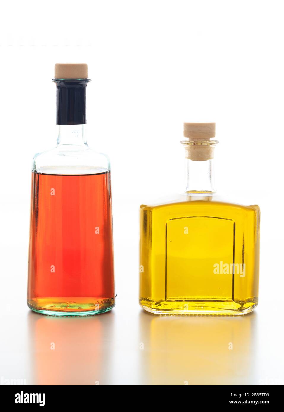 Olive oil and vinegar bottles isolated. Transparent glass bottles with