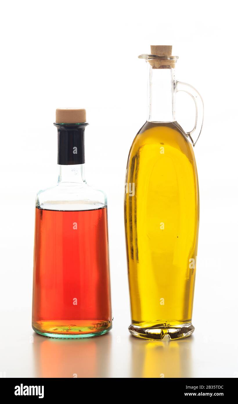 Olive oil and vinegar bottles isolated. Transparent glass bottles with