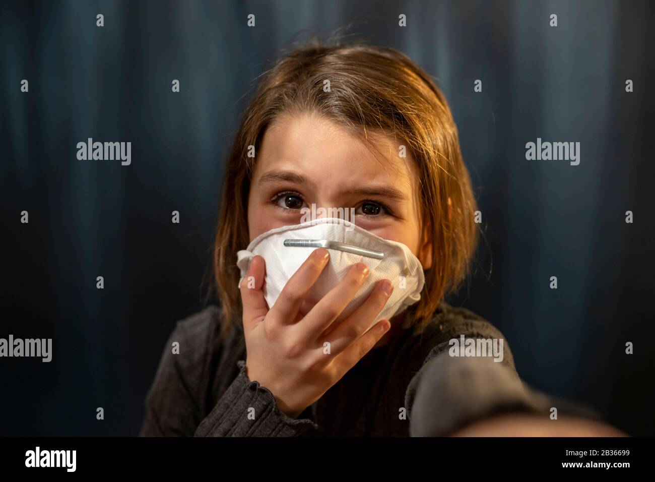 Young girl wearing a protection mask against the corona virus Stock Photo