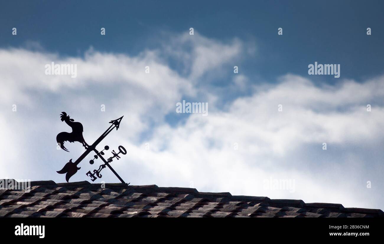 A crooked weather vane that points out a bad direction and a bad way Stock Photo