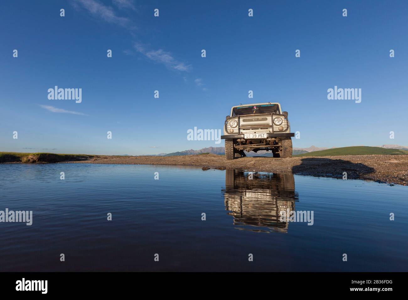 Mongolia, Khovsgol province, steppe near Ulaan Uul, Russian jeep UAZ 469 fording a river Stock Photo