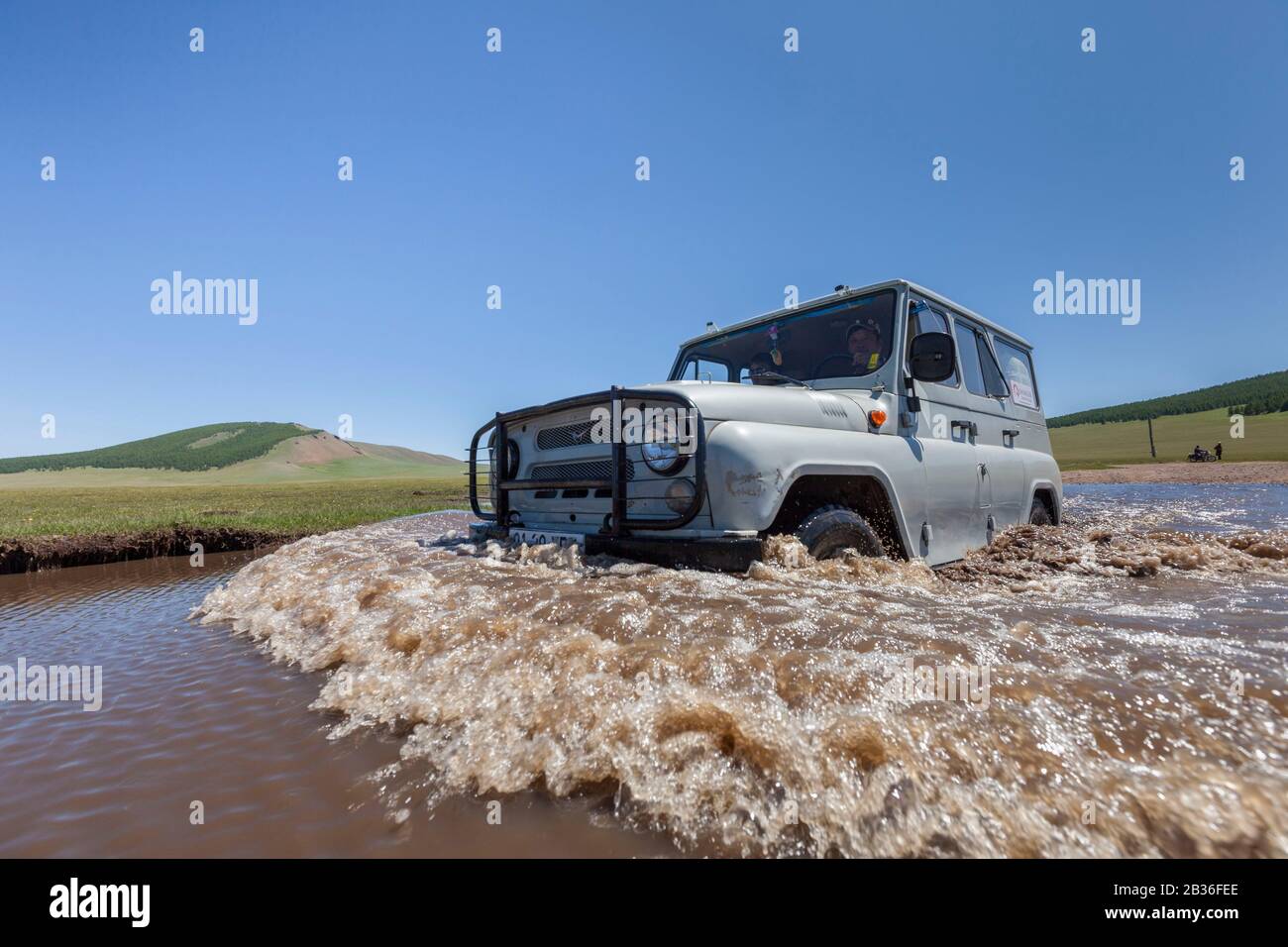 Mongolia, Khovsgol province, steppe near Toom, Russian jeep UAZ 469 fording a river Stock Photo