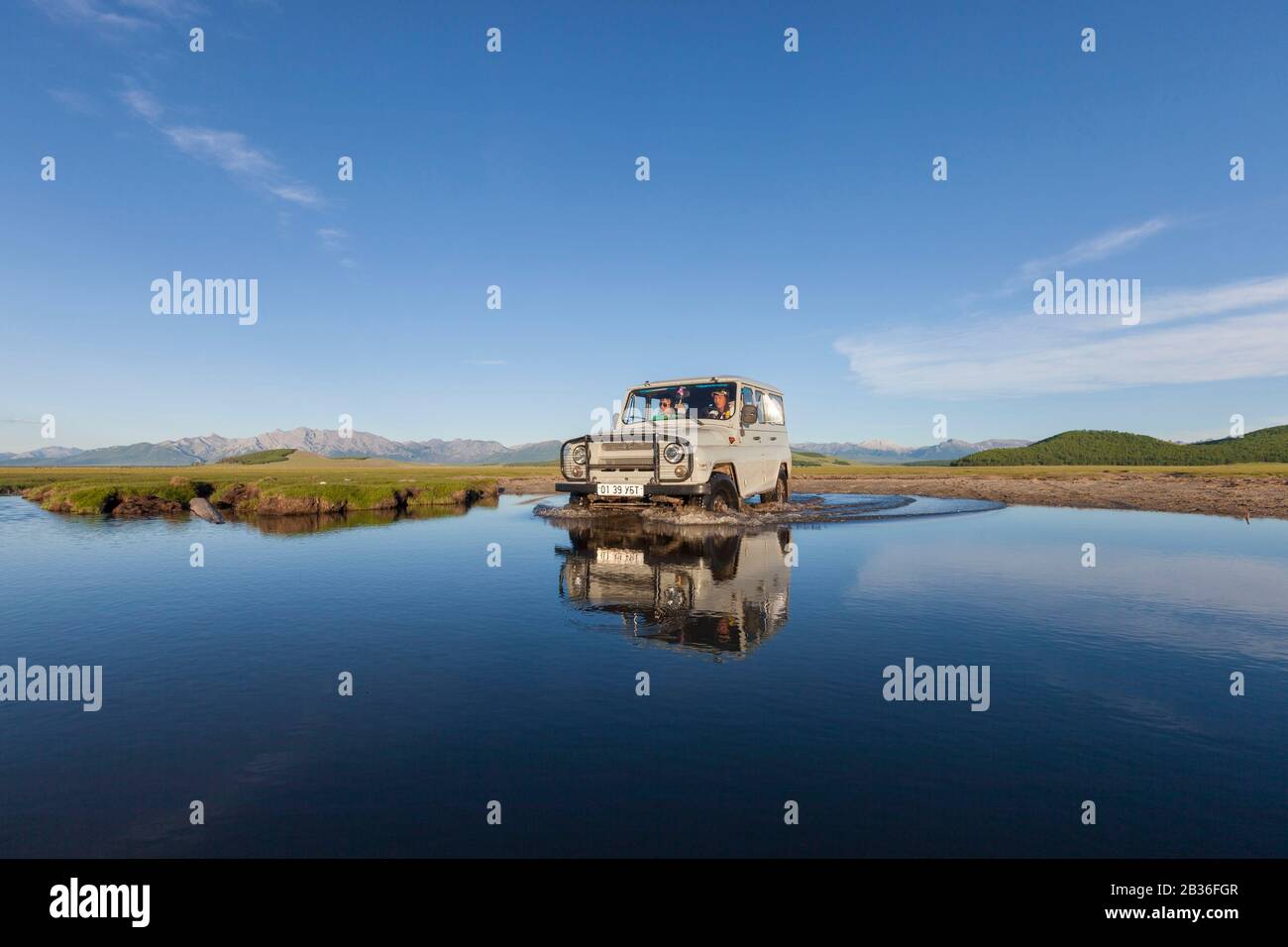 Mongolia, Khovsgol province, steppe near Ulaan Uul, Russian jeep UAZ 469 fording a river Stock Photo