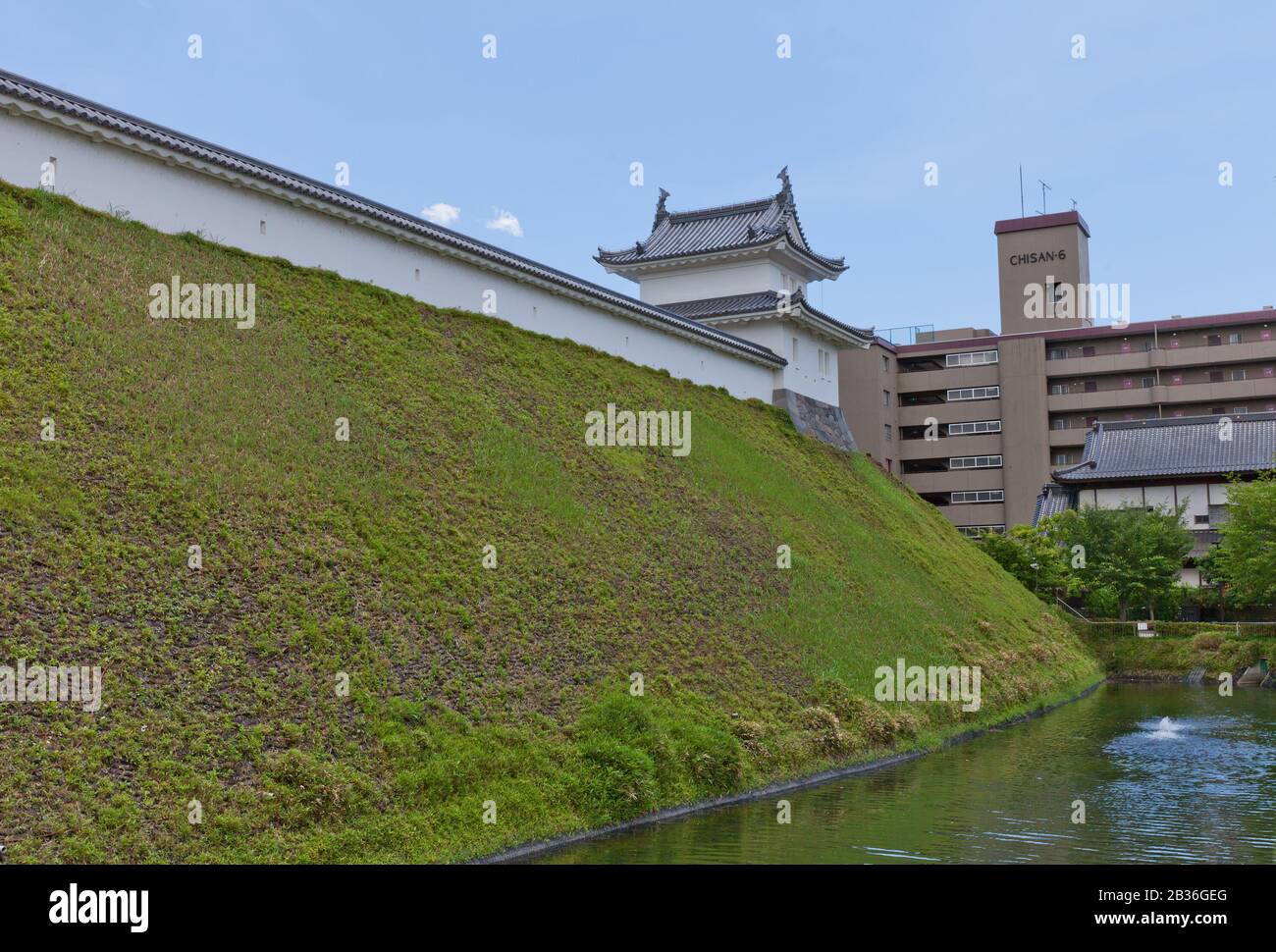Moat, earthen wall (dorui) and Fujimi Turret of Utsunomiya Castle, Japan. Castle was founded in 1062, destroyed in 1868 and reconstructed in 2007 Stock Photo