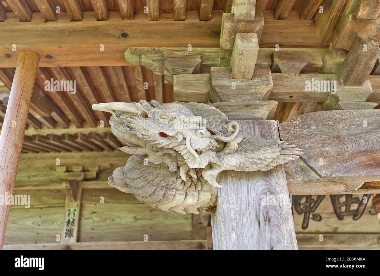 Carved dragon of Akita Shinto Shrine (1879) in Yokote, Japan. Shrine is located on the former main bailey (honmaru) of Yokote Castle Stock Photo