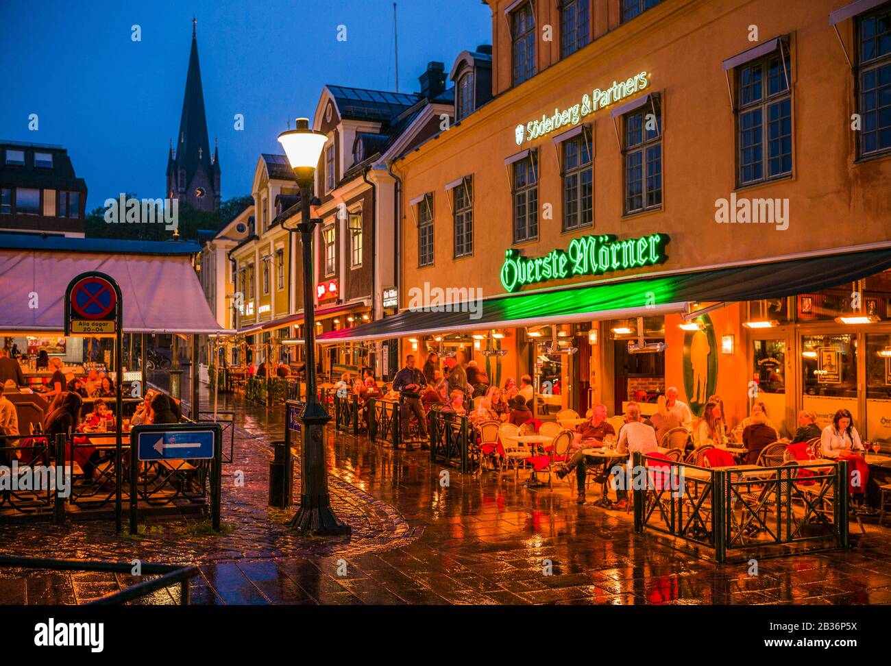 Sweden, Southeast Sweden, Linkoping, cafes and bars on Stora torget square, dusk Stock Photo