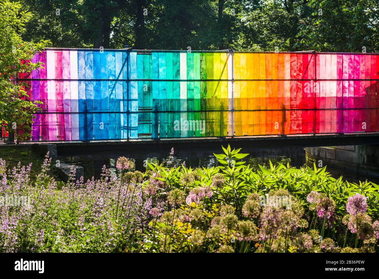Sweden, Narke, Orebro, Slottsparken park, park bridge draped with rainbow-colored plastic Stock Photo