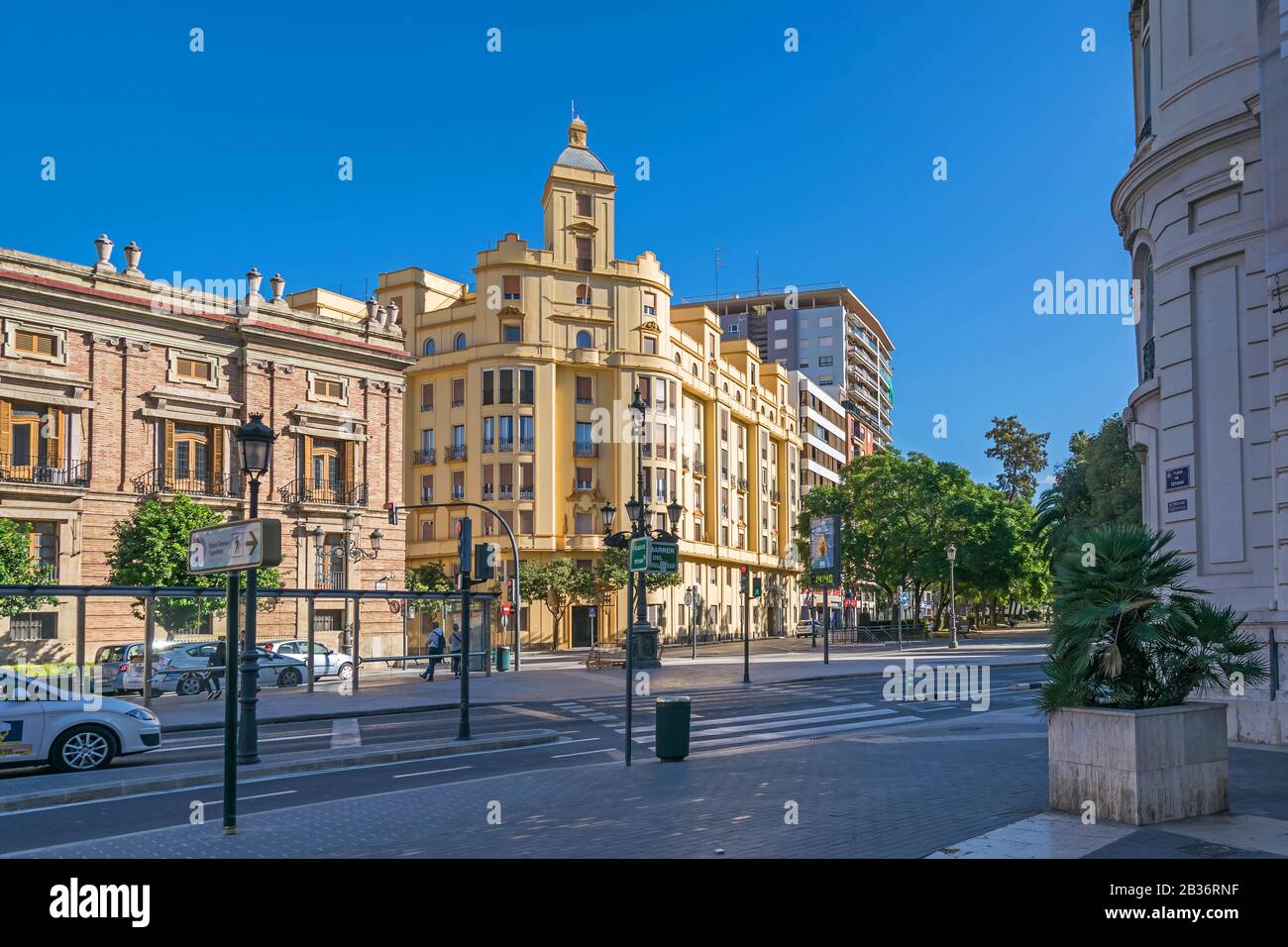 Valencia, Spain - November 3, 2019: Plaza Tetuan with the Santo Domingo Convent or Captaincy General  and a residential building at the corner to Gene Stock Photo