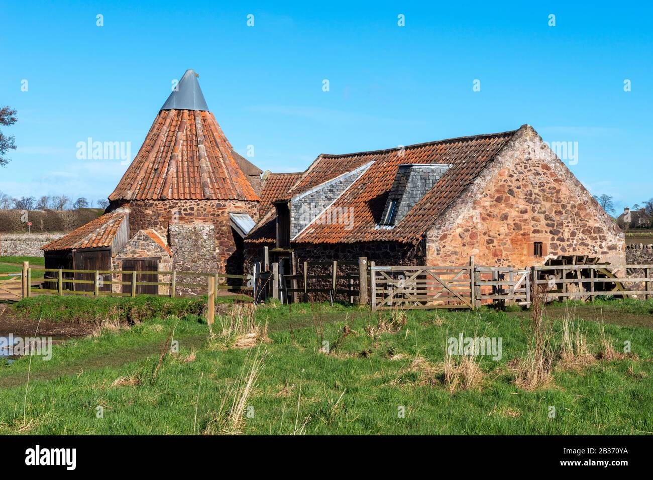 Preston Mill, a historic water mill, on the River Tyne near East Linton in East Lothian, Scotland, United Kingdom Stock Photo