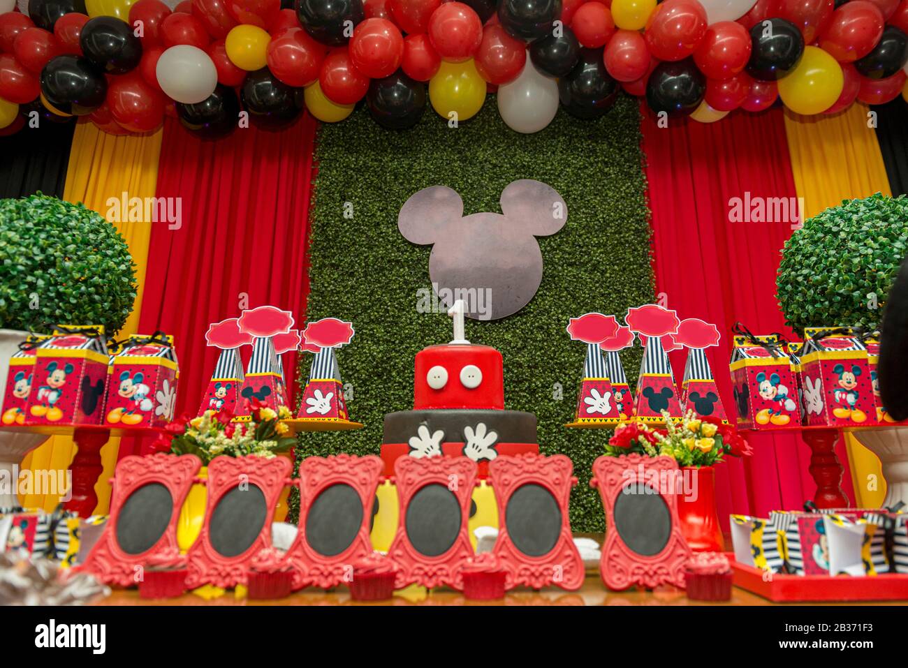 Florianopolis - Brazil. February 2, 2020: Birthday reception. Sweet table decorated with Mickey Mouse theme. Table with sweets, candies, dessert and c Stock Photo