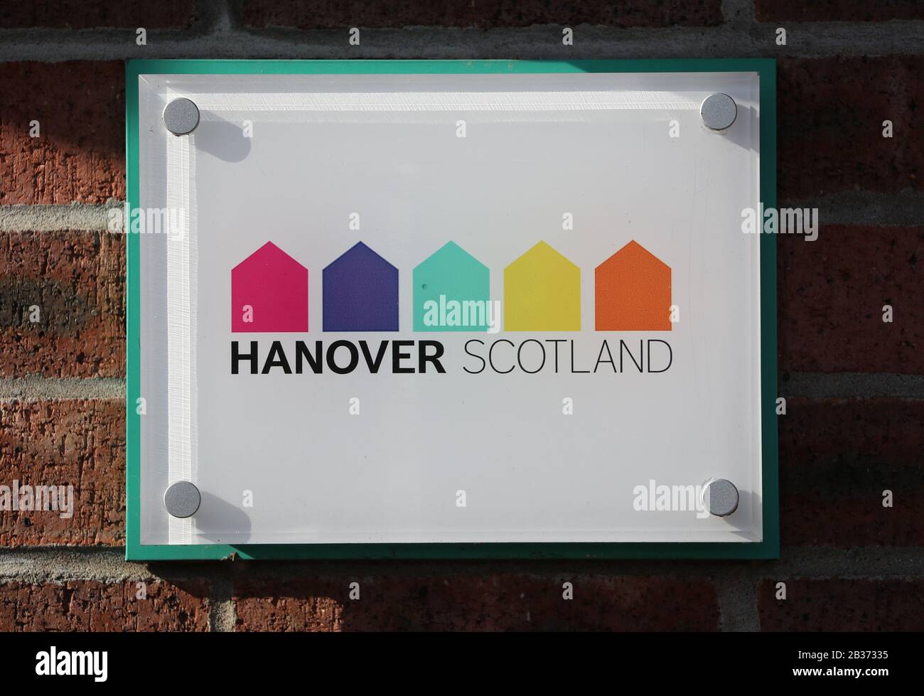 A Hanover Scotland sign is visible at the entrance to a Hanover Scotland sheltered housing complex in Kilmarnock, East Ayrshire. It was confirmed a resident at one of their developments in Ayrshire had recently returned from south-east Asia and reported feeling unwell. Stock Photo