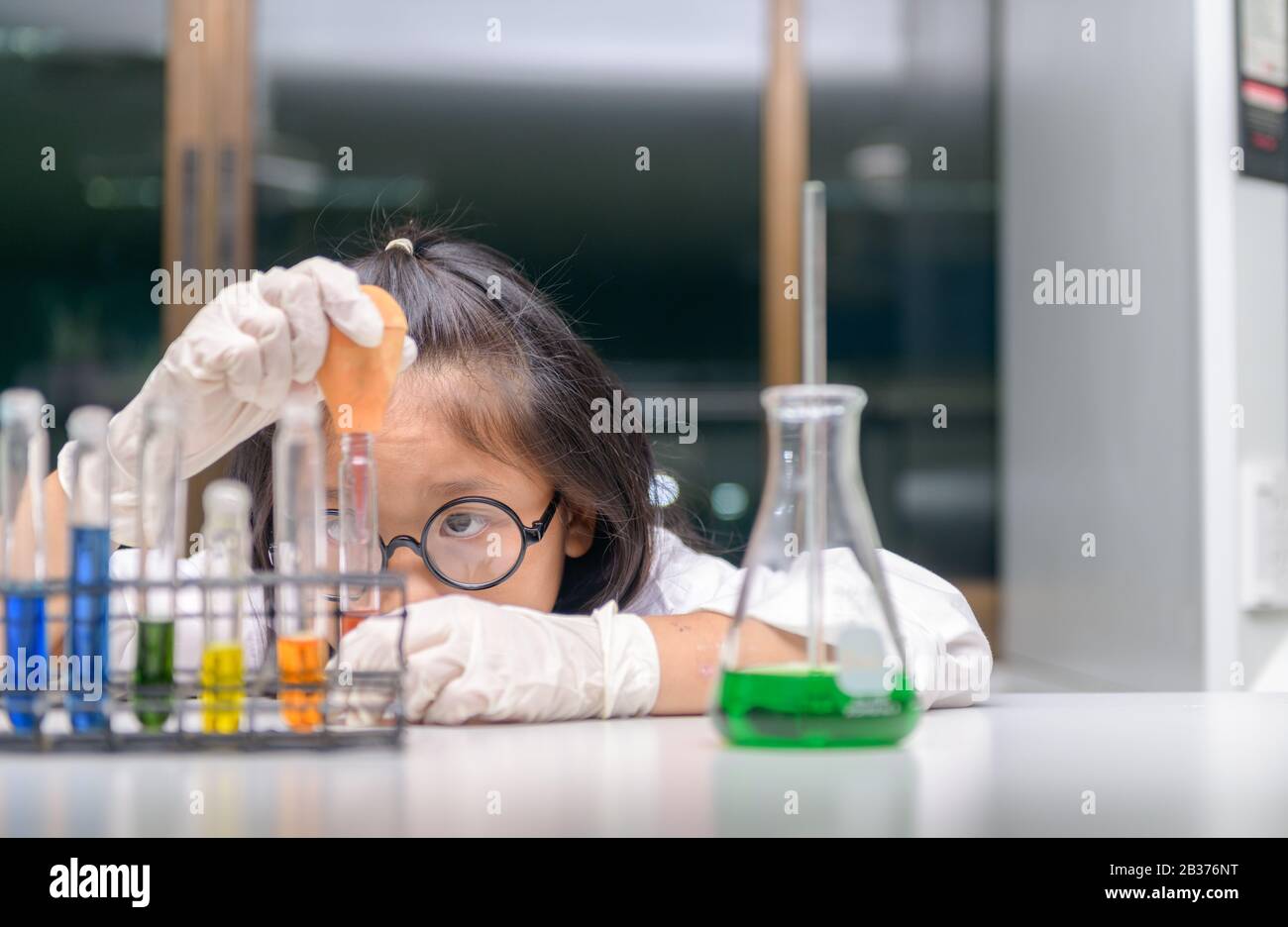 Little scientist use dropper to making experiment in chemical