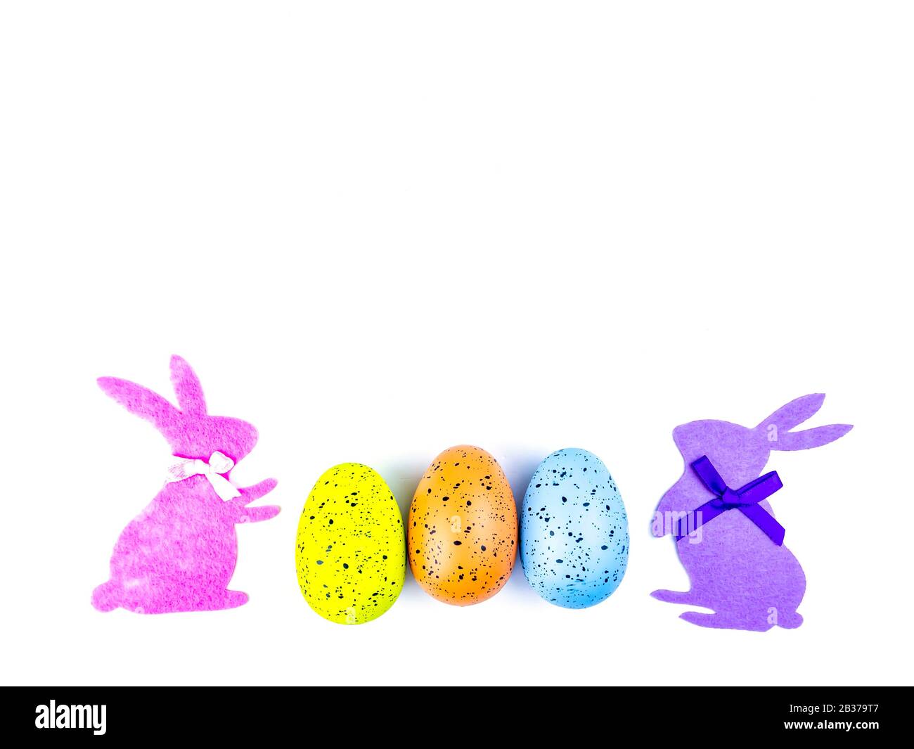 Easter eggs and rabbit on a white background Stock Photo - Alamy